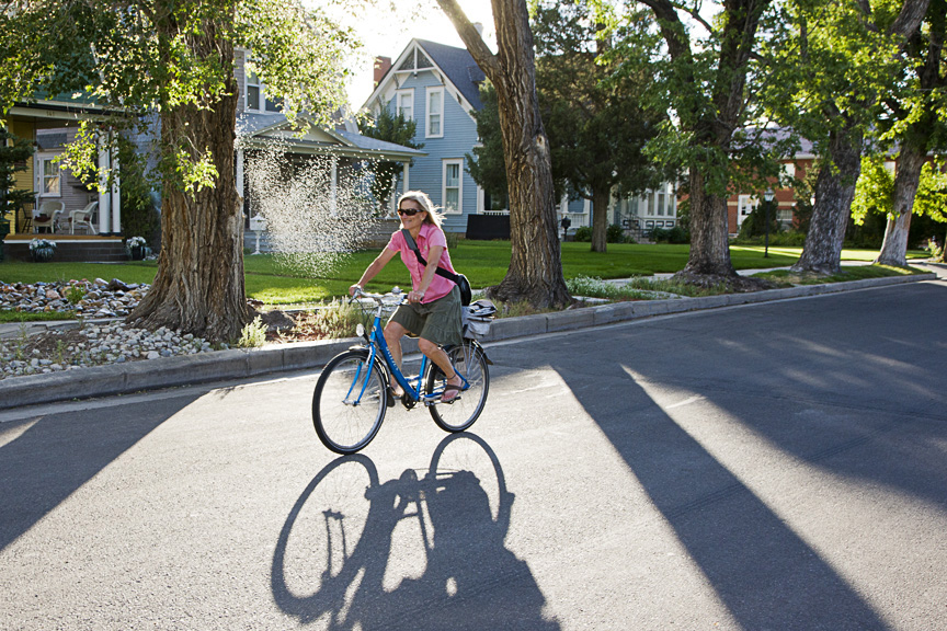 Lisa pedaling on 5th Street, Salida